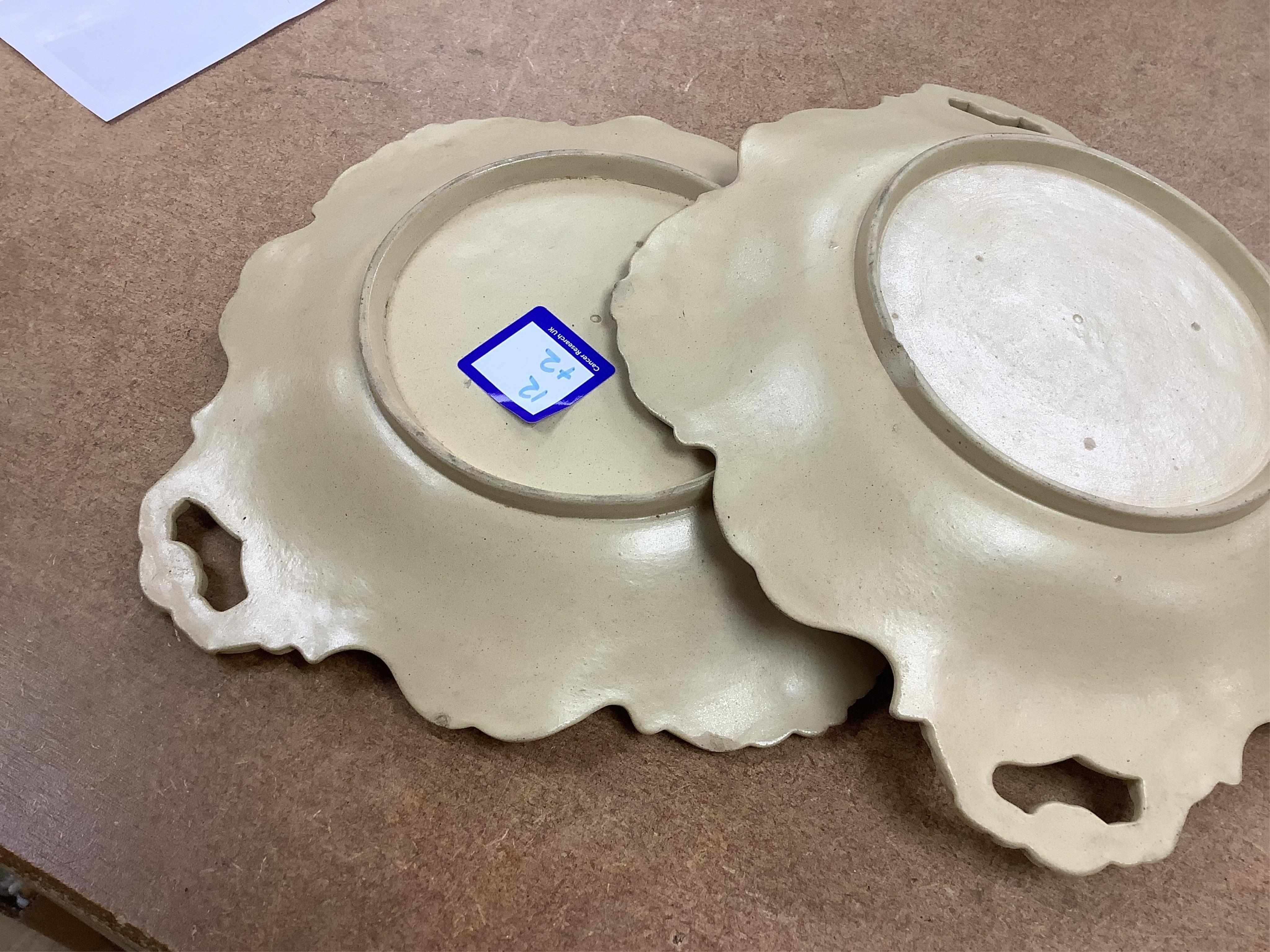 A Victorian drabware part dessert set, comprising eleven plates and three two handled dishes, dishes 25cm wide